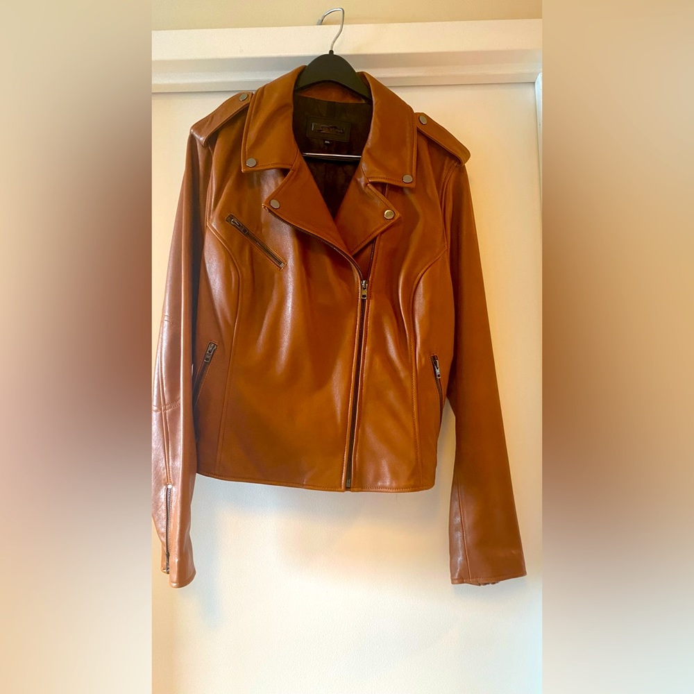 Luxurious genuine leather bomber jacket. Color is honey.